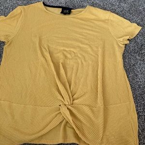 Yellow shirt. Brand is w5. It’s a large in woman’s